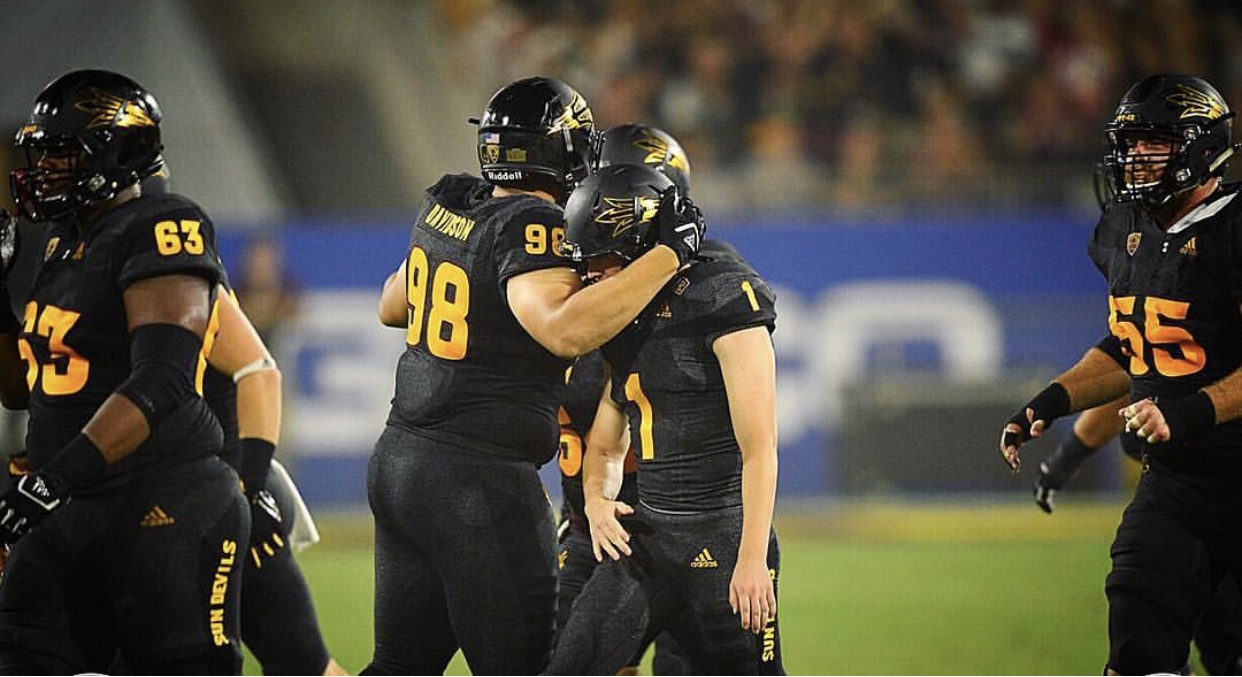 Davidson (98) celebrating with teammates at Arizona State