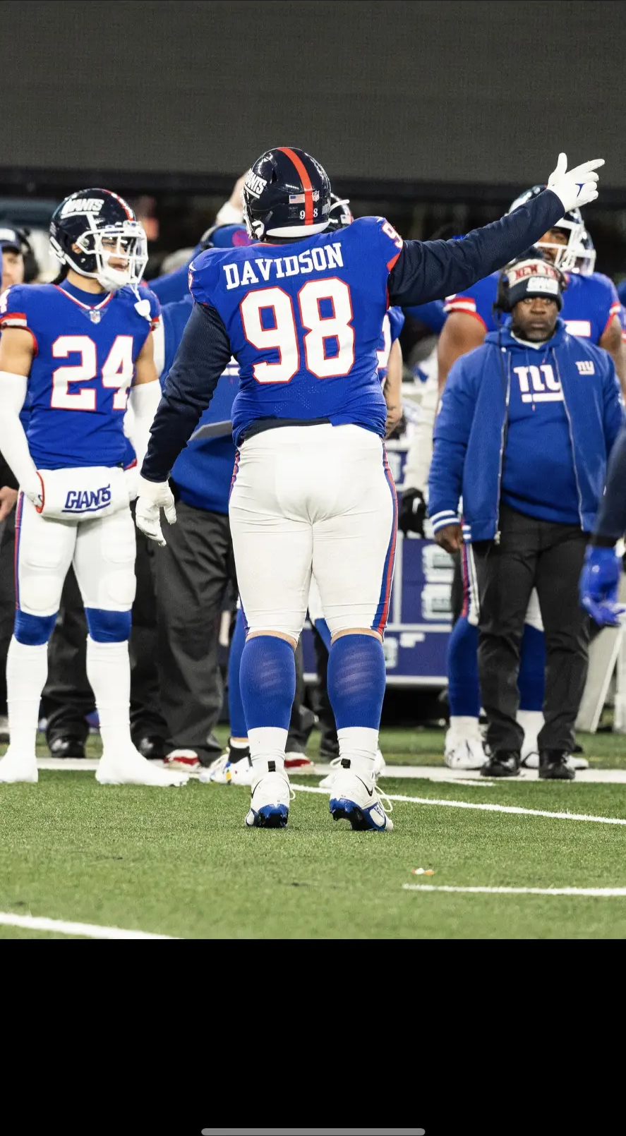 Davidson (98) signaling to the crowd at MetLife Stadium