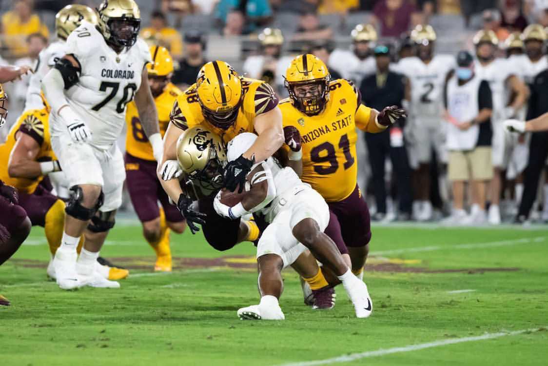 Davidson making a tackle against Colorado