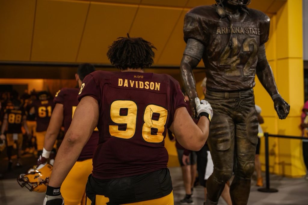Devonta Davidson in his Arizona State No. 98 jersey walking out of the tunnel